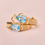 Modern 14ct Yellow Gold Blue Topaz & Diamond Post & Omega Clip Earrings.