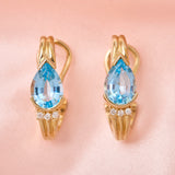 Modern 14ct Yellow Gold Blue Topaz & Diamond Post & Omega Clip Earrings.